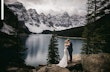 Bride wearing Nelly wedding dress by Rebecca Ingram kissing her husband