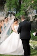 Bride wearing Nisha by Maggie Sottero being married during her ceremony