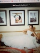 Bride resting on sofa with ball gown wedding dress on called Anastasia.