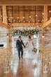 Bride Wearing Lace Beaded Wedding Dress Called Charmaine By Maggie Sottero And Groom Holding Hands