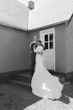 Bride wearing Aston by Sottero and Midgley hugging her husband