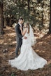 Groom with Bride in Sweetheart Neckline Wedding Dress with Floral Lace Motifs Called Hattie Lane Lynette Marie by Rebecca Ingram