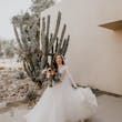Bride Holding Tulle Skirt Wearing Long Sleeve Lace Ball Gown Called Mallory Dawn By Maggie Sottero
