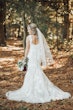 Bride in Scoop Back Wedding Dress with Floral Lace Motifs Called Hattie Lane Lynette Marie by Rebecca Ingram