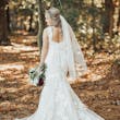 Bride in Scoop Back Wedding Dress with Floral Lace Motifs Called Hattie Lane Lynette Marie by Rebecca Ingram