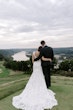 Bride Wearing Lace Backless Wedding Dress Called Chauncey By Sottero And Midgley With Groom On A Hill