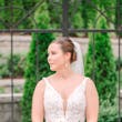 Bride wearing Johanna by Maggie Sottero holding her bouquet