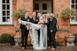 Bride In Illusion Train Edison Maggie Sottero With Groomsmen