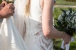 Bride wearing Davis Leigh wedding dress by Sottero and Midgley up close details