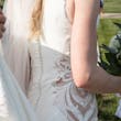 Bride wearing Davis Leigh wedding dress by Sottero and Midgley up close details