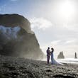 Bride wearing Tuscany Lynette by Maggie Sottero with her husband on the beach