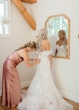 Bride wearing Hattie Lynette by Rebecca Ingram being zipped up