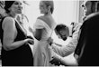 Bride wearing Ekaterina by Maggie Sottero being zipped up