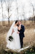 Bride Wearing Ballerina-inspired Romantic Wedding Dress Called Fairbanks By Maggie Sottero In A Field With Groom