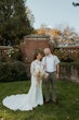 Bride Wearing Crepe Wedding Dress Called Dionne By Rebecca Ingram And Groom Looking At Each Other