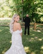 Bride wearing Hattie Lynette by Rebecca Ingram doing a first look with her husband