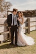 Bride wearing Bridget by Maggie Sottero smiling at her husband