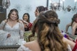 Bride wearing Seneca wedding dress by Sottero and Midgley getting ready